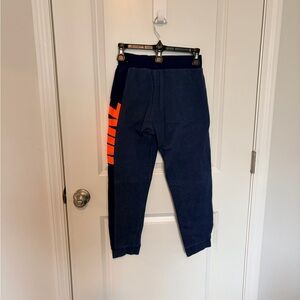 Nike Kids Blue Joggers with Bright Orange Detail